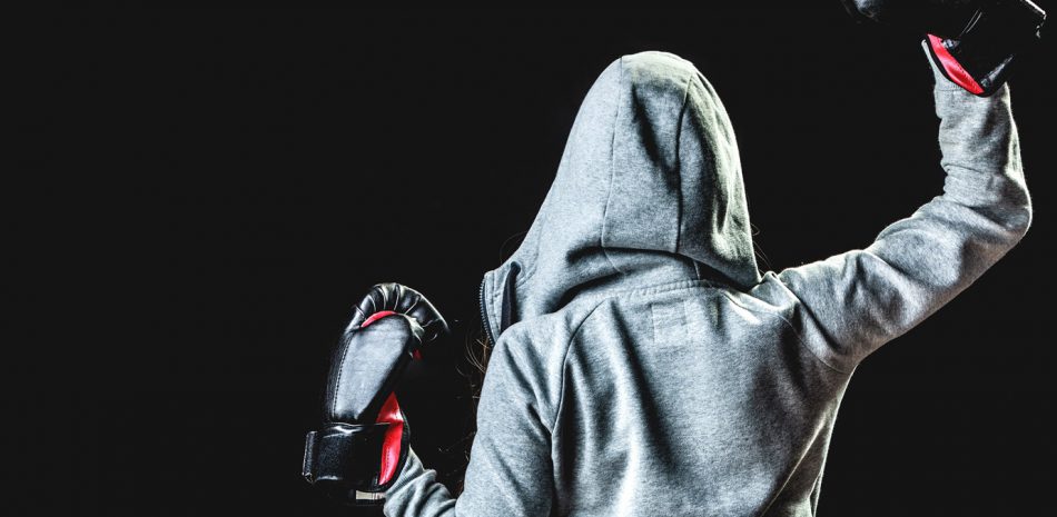 Sport boxer woman in black gloves boxing